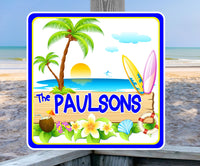 Cartoon-style personalized tropical island sign featuring coconut cocktail, palm trees, beach sunset, surfboards, and a life preserver, with editable text options.