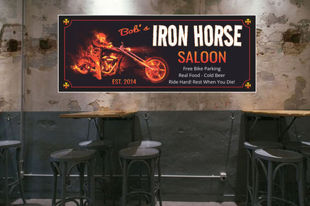 Custom personalized biker bar welcome sign with editable text, featuring a custom chopper, red-hot flames, Satan skull imagery, a crazy biker gang member, and an iconic iron cross.