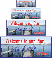  Personalized pier welcome sign for boat owners with a photographic lake background, blue skies, and wooden pier. Customizable text for a unique nautical touch. Perfect for docks and boathouses.