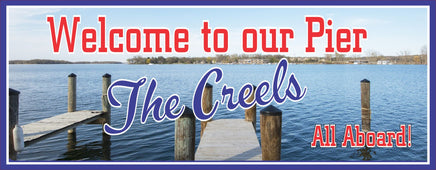  Personalized pier welcome sign for boat owners with a photographic lake background, blue skies, and wooden pier. Customizable text for a unique nautical touch. Perfect for docks and boathouses.