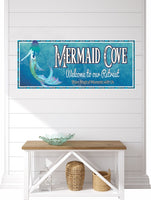 Custom blue beach house sign featuring a whimsical mermaid with a shimmering tail and cascading hair. The sign has a scroll design border evoking ocean waves and elegant, customizable fonts for your family name and personalized text. Perfect for beach houses, coastal retreats, beach bars, or sailboats.