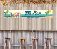 Personalized aluminum tiki bar sign featuring a beach scene with rippled waves, palm trees, and tropical drinks, with customizable text.